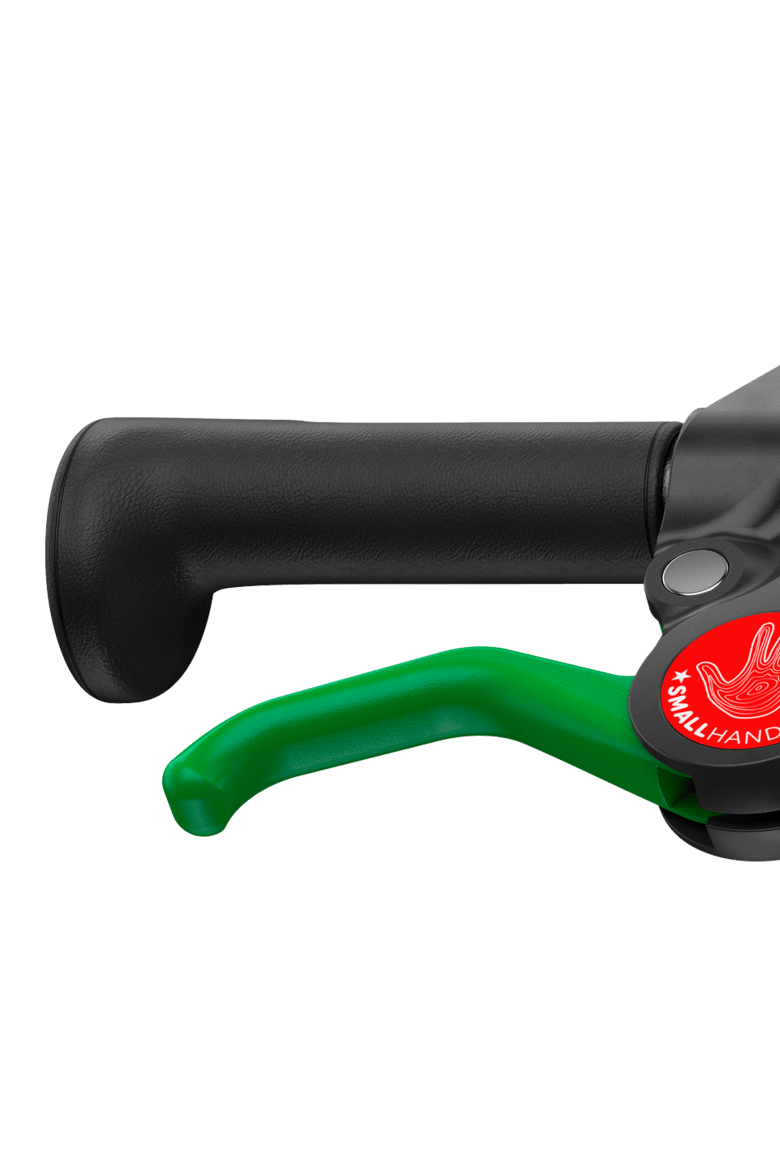 Detailed view of the green brake lever on the woom GO 1 PLUS balance bike with 14″ wheels