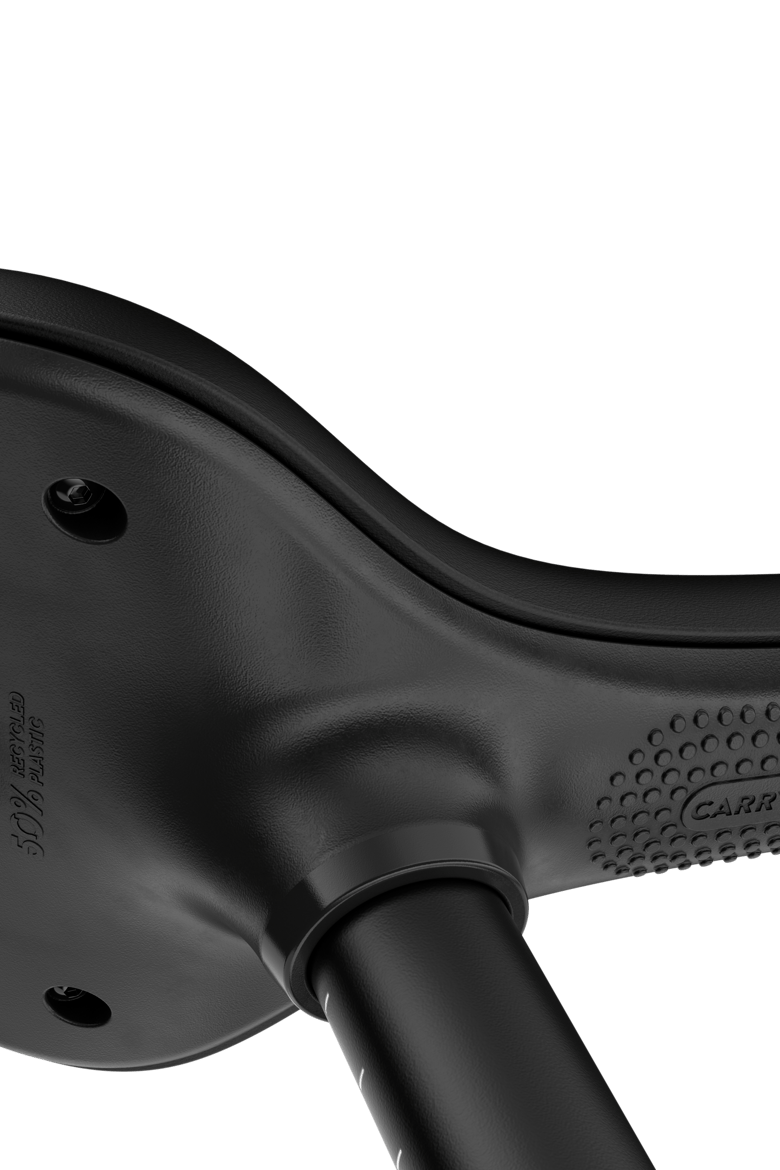 Detailed view of the textured underside of the saddle that makes it nice and easy to carry the woom GO 1 PLUS balance bike