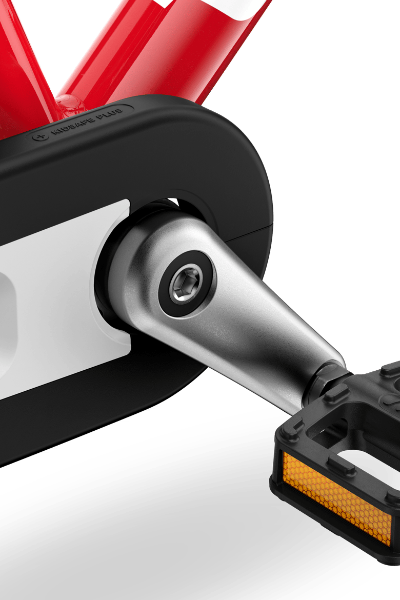 Detailed view of the pedals, cranks and chainguard on the woom GO 2 children's bike