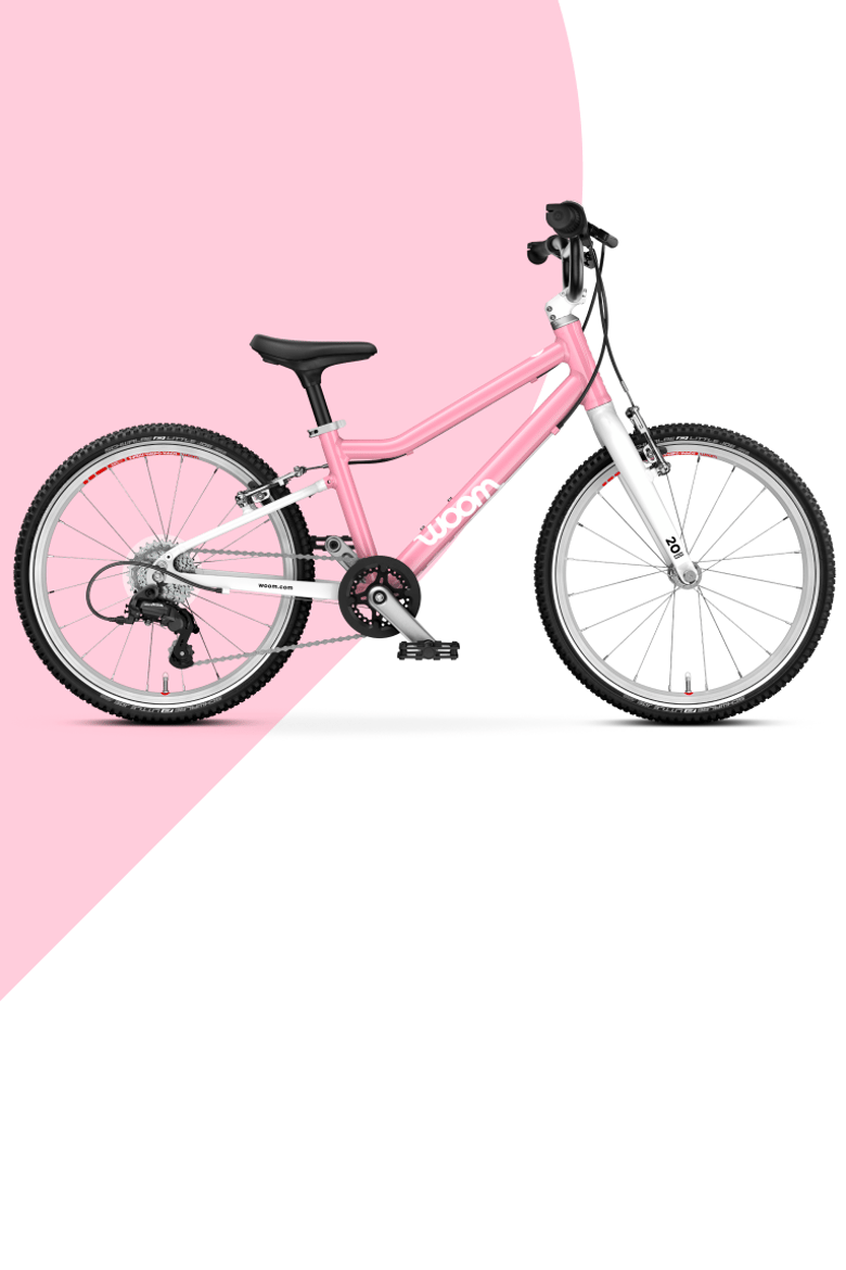 A woom GO 3 16" bike in powder pink for kids aged 4 to 6 years, viewed from the side
