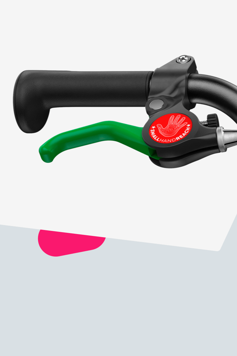 Detailansicht des grünen Bremshebels für die Hinterradbremse an den woom GO Fahrrädern