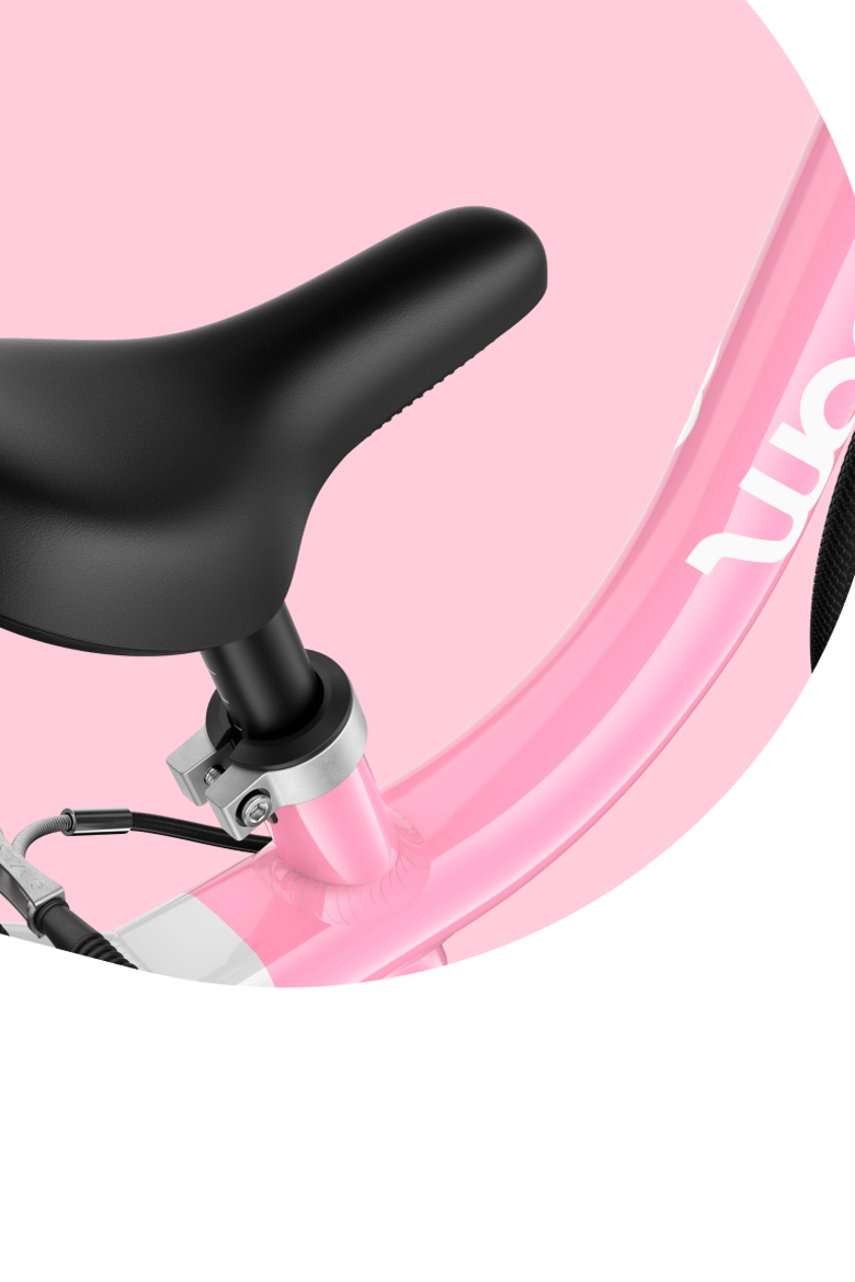 Detailed shot of the woom GO children's bike frame in the limited edition powder pink