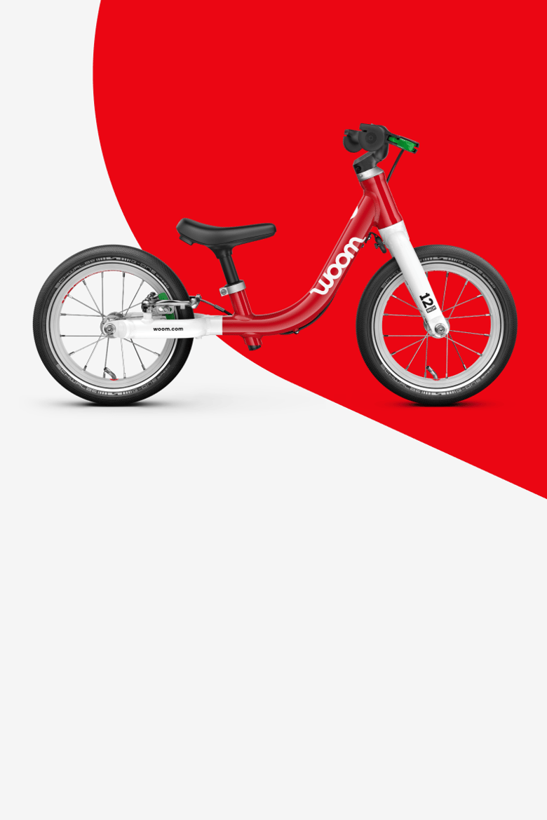 Widok z boku rowerka biegowego woom GO 1 dla dzieci od 18. miesiąca.