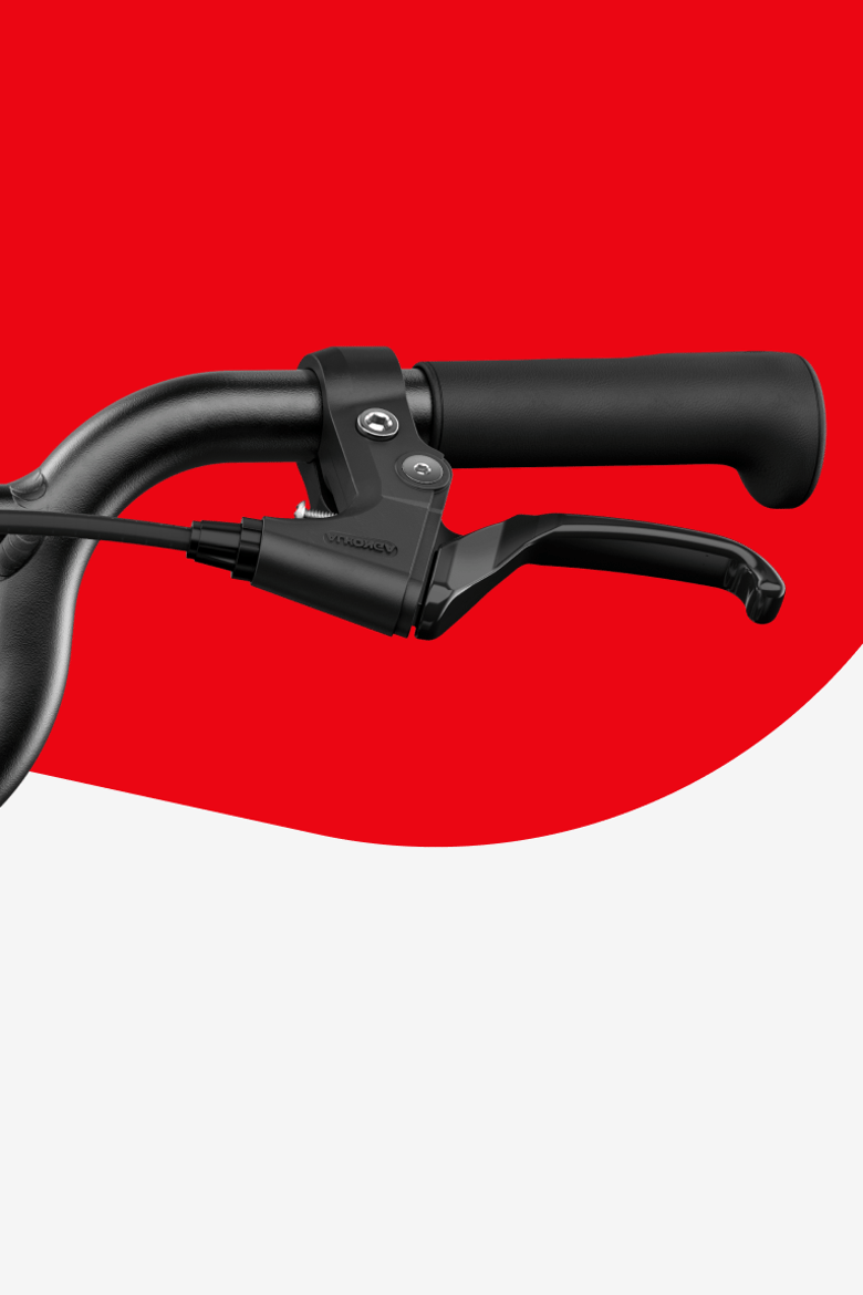 Detail van een remhendel op de woom GO 4 kinderfiets met 20" wielen.