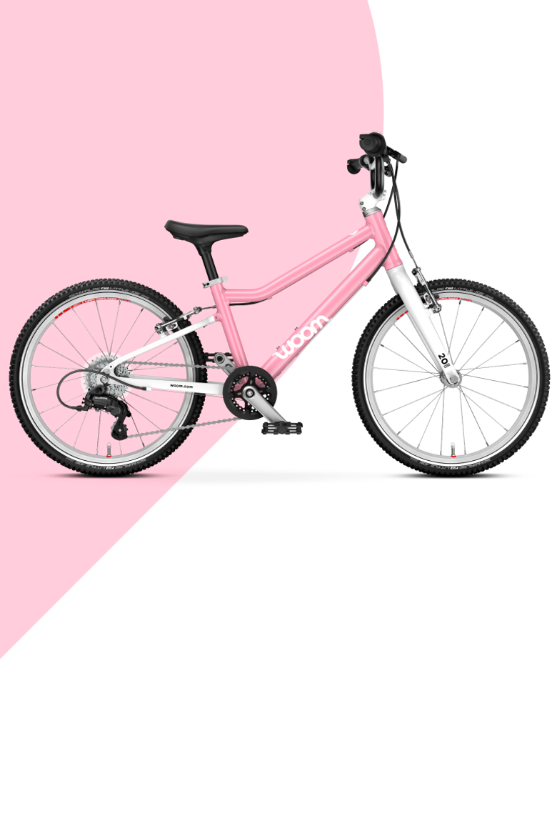 Vue latérale du vélo woom GO 3 de 16 pouces en powder pink pour les enfants de 4 à 6 ans