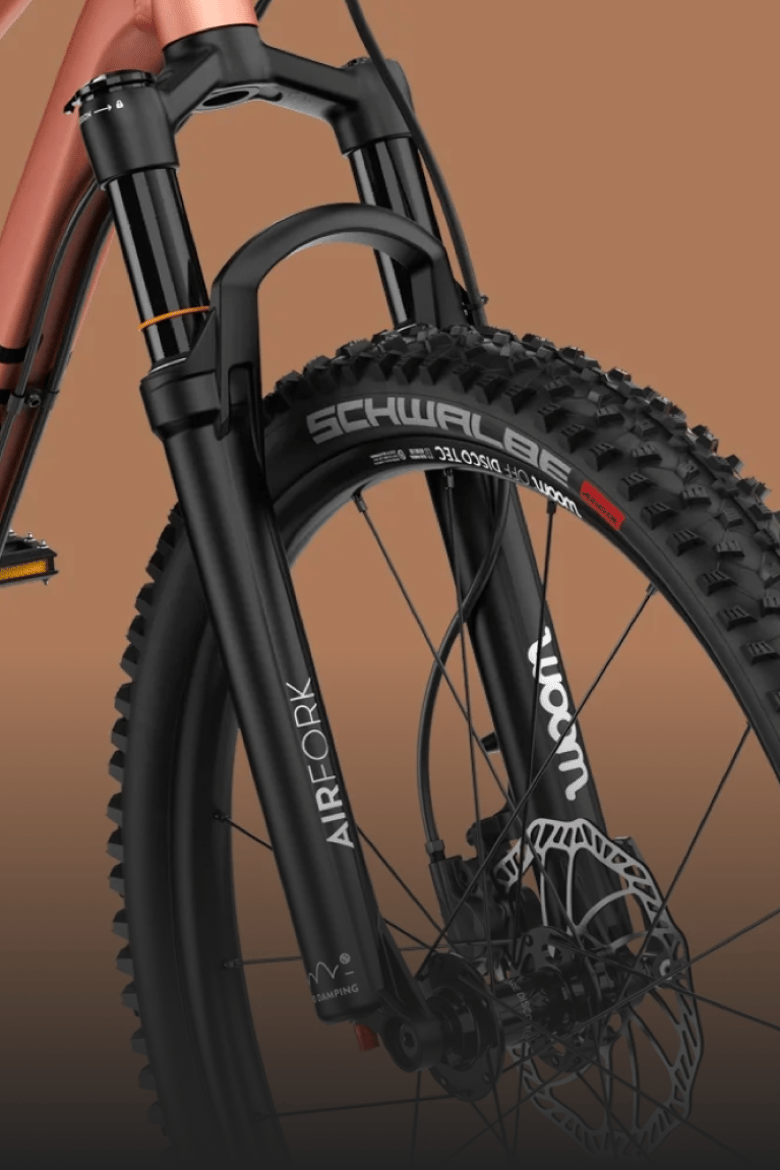 Detailed view of the black suspension fork on the woom OFF AIR kids' mountain bike