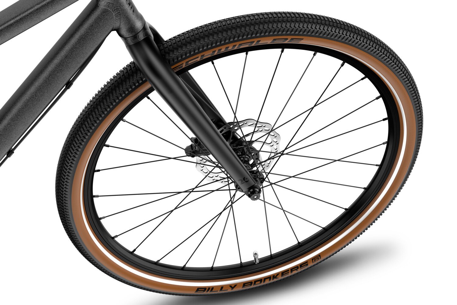 Detailansicht des vorderen Laufrads am woom EXPLORE e 6 – mit schwarzem Profil und braunen Reifenflanken.