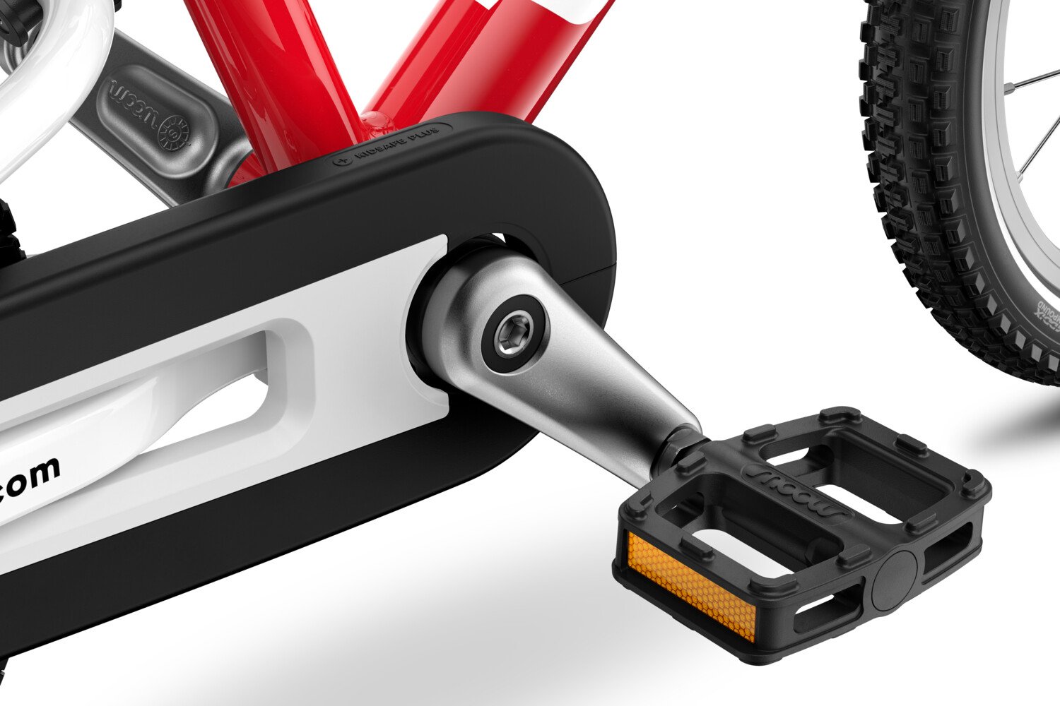 Detailed view of the pedals, cranks and chainguard on the woom GO 2 children's bike