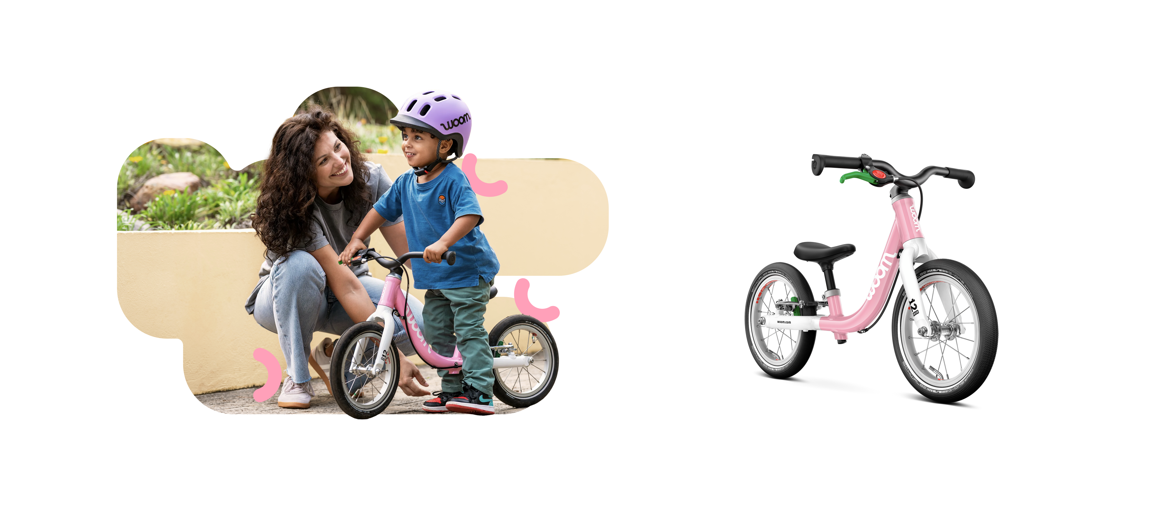 Child wearing a purple woom READY helmet on a pink woom GO 1 balance bike, looking at a woman.