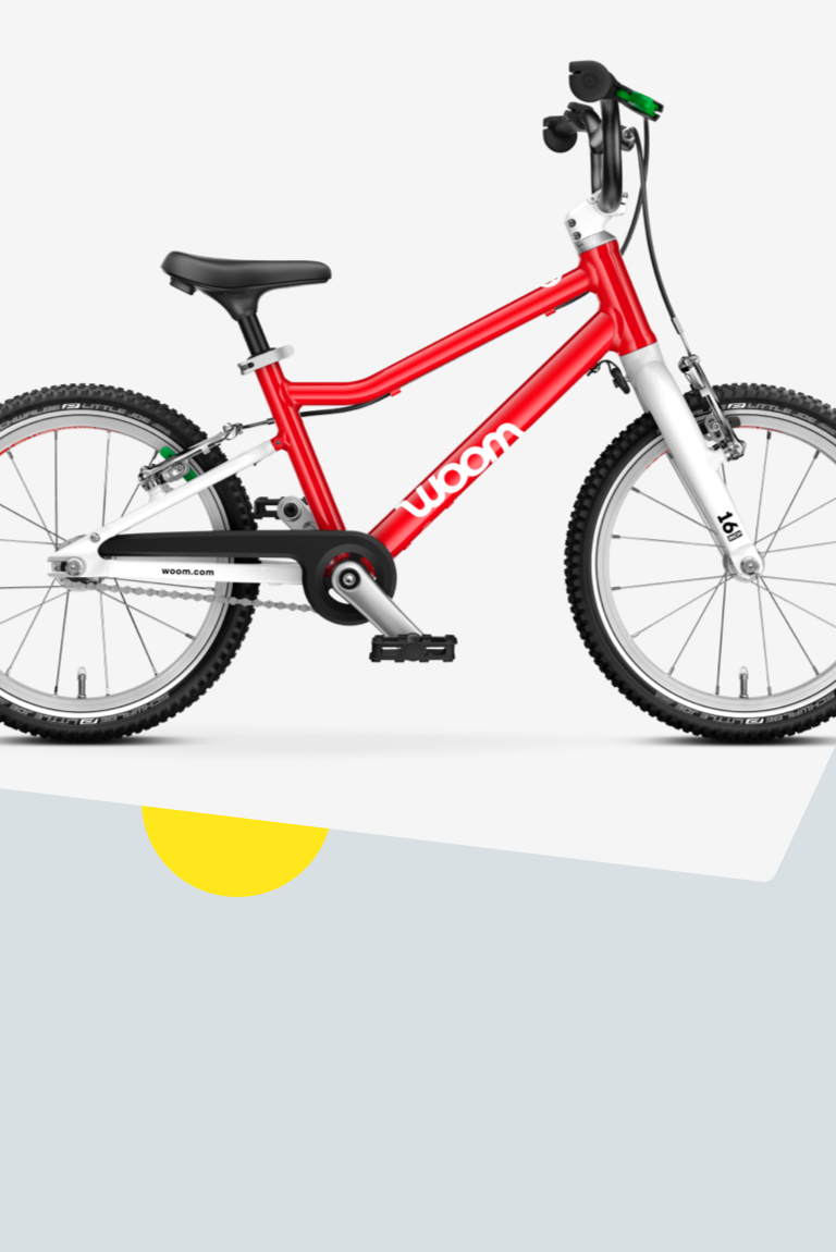 Vue latérale du vélo woom GO 3 de 16 pouces en rouge pour les enfants de 4 à 6 ans