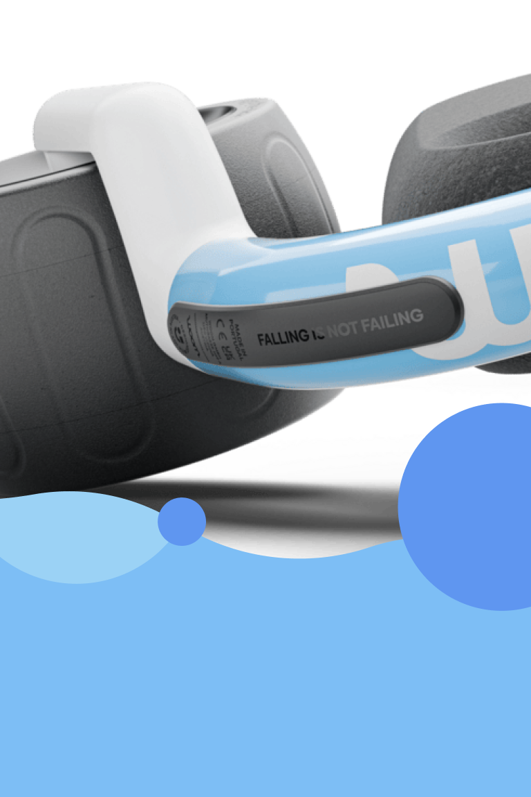 Close-up view of the bottom of the woom WOW in light blue. Text reads "Falling is not failing".
