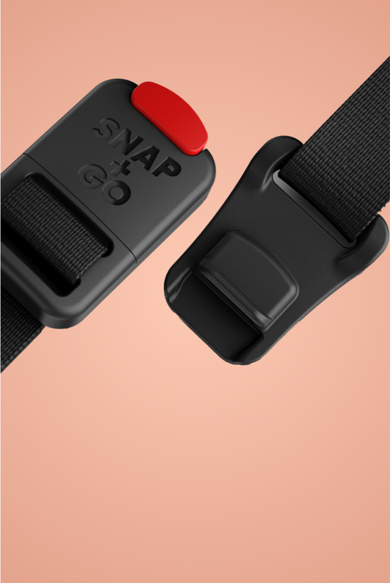 Close-up of the magnetic buckle on the READY Kids' Helmet by woom, viewed on a colored background"