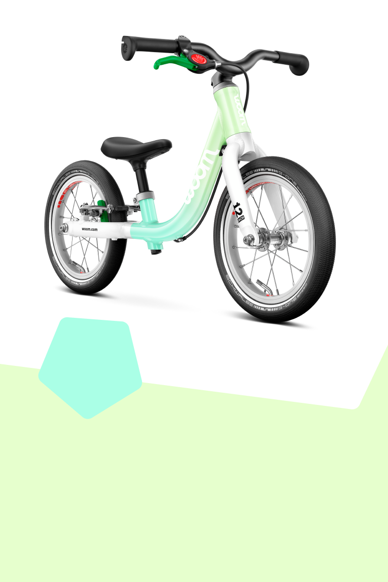 Side front view of a 16" woom GO 3 bike in the spearmint crush colorway for kids aged 4 to 6 years