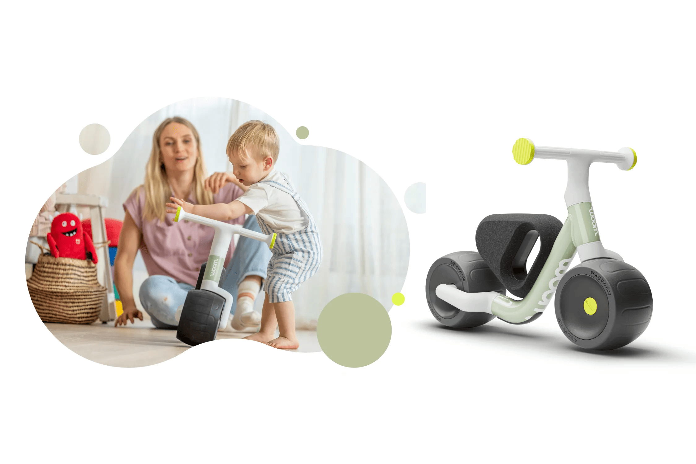 Mother watches her toddler son hold a WOW bike in the color Soft Sprout
